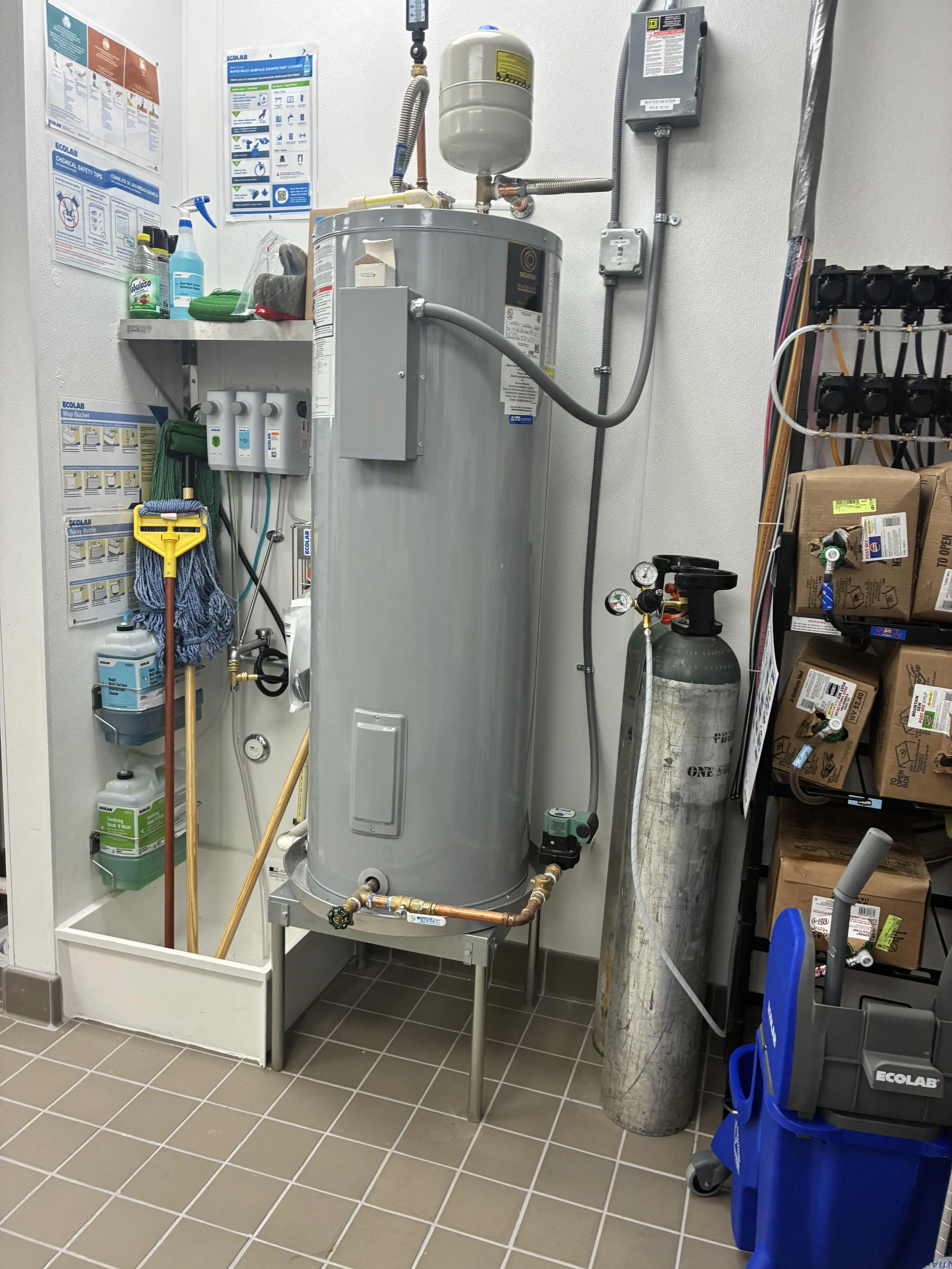 Commercial gas water heater and expansion tank installation by Sidney Cox Plumbing Co in Austin TX